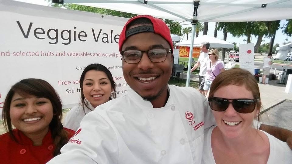 Chef Jelani and C·CAP students at the Veggie Valet community booth